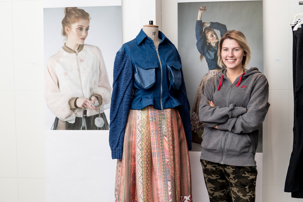 A student stood next to a mannequin