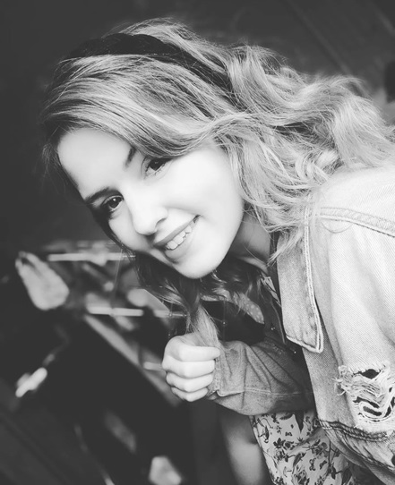 A female graduate from product design course in black and white photo.