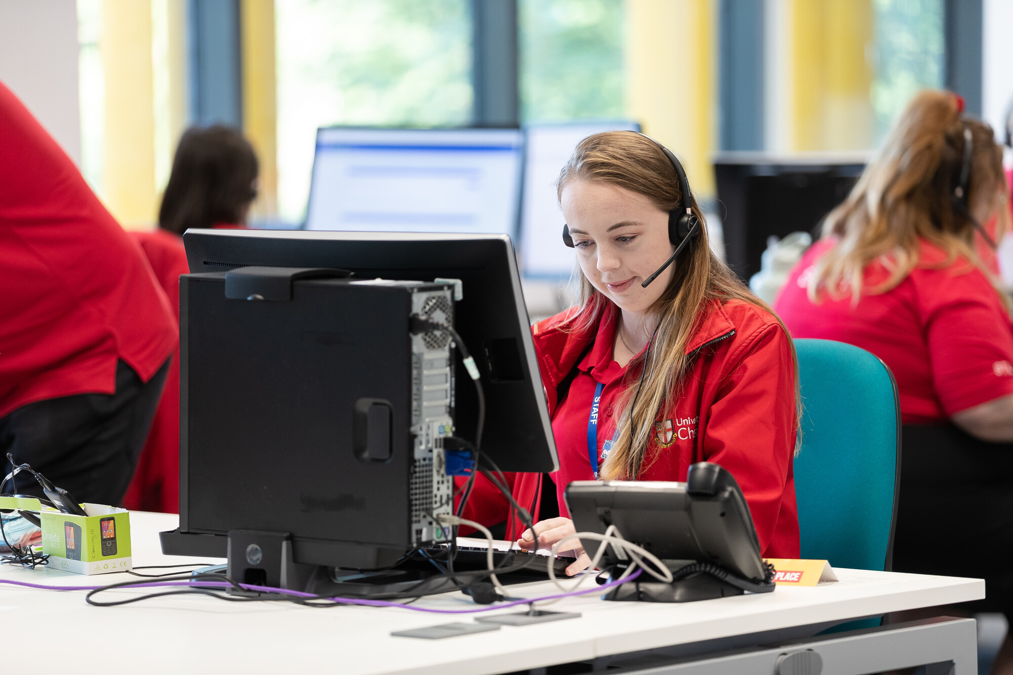 Member of staff answering calls on the Clearing hotline