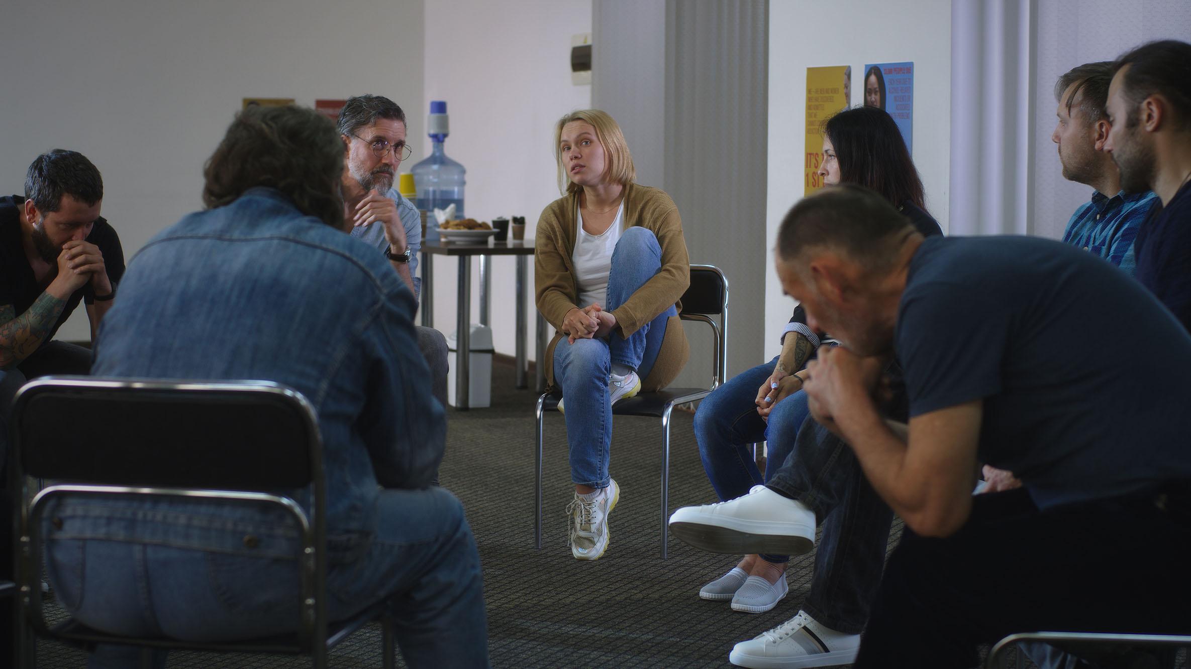 Woman speaking about traumatic event during psychotherapy session.